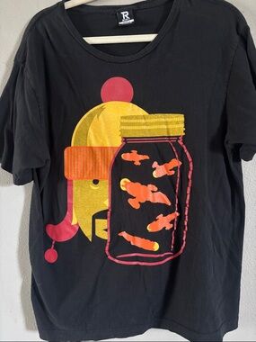 Black Graphic Tee with Gold & Orange Jar Design